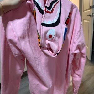 Stylish Pink Hoodie with Graphic Design